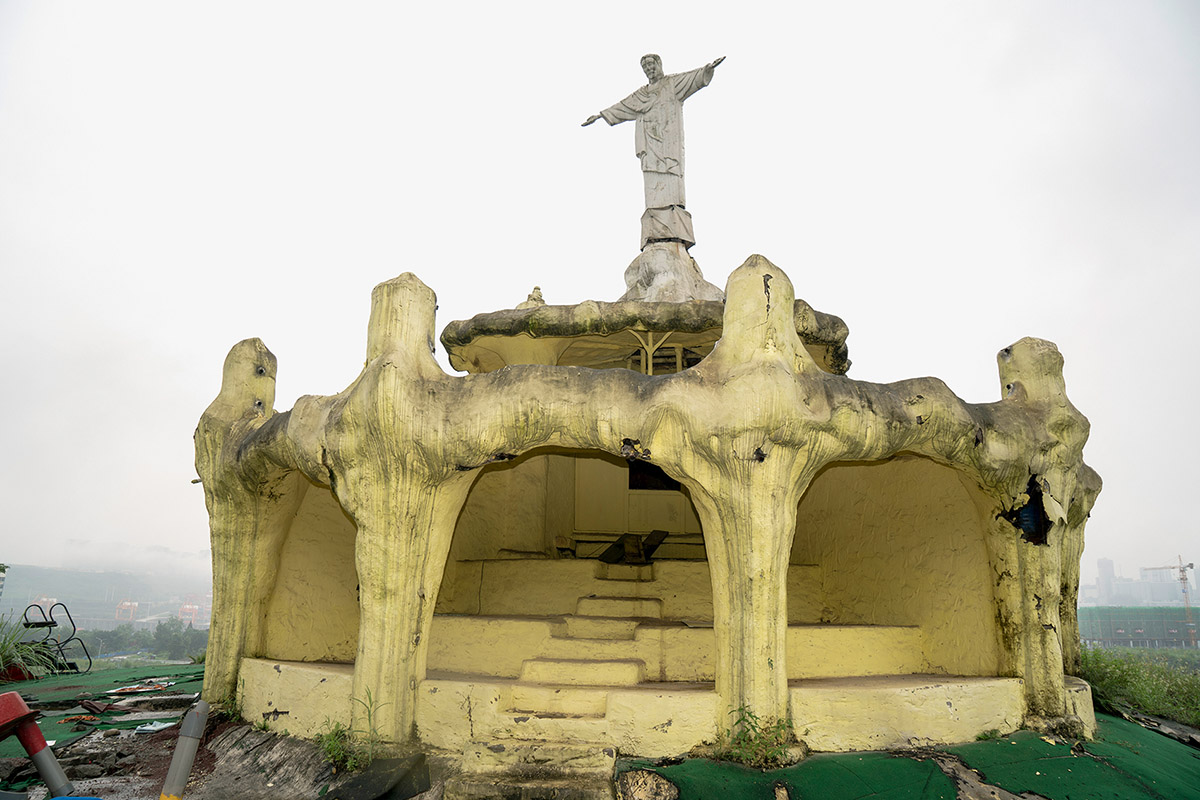 Ruben Lundgren, Chongqing 2020, A attempted replica of Rio's Christ the Redeemer statue in the notorious Mexin Foreigner Street amusement park. From the early 2010s the park, open 24/7 with no entry ticket, had gained a reputation so weird that you simply had to go and see for yourself. In 2019 it was broken down to make space for the ever-expanding Chongqing metropolis.
