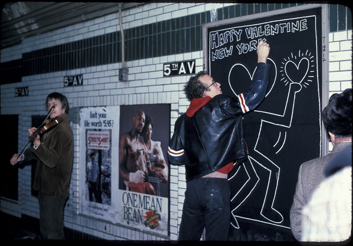 Keith Haring drawing in New York City Subway, New York, 1983, Photograph: Tseng Kwong Chi, Muna Tseng Dance Projects, Inc. Artwork: Keith Haring Foundation