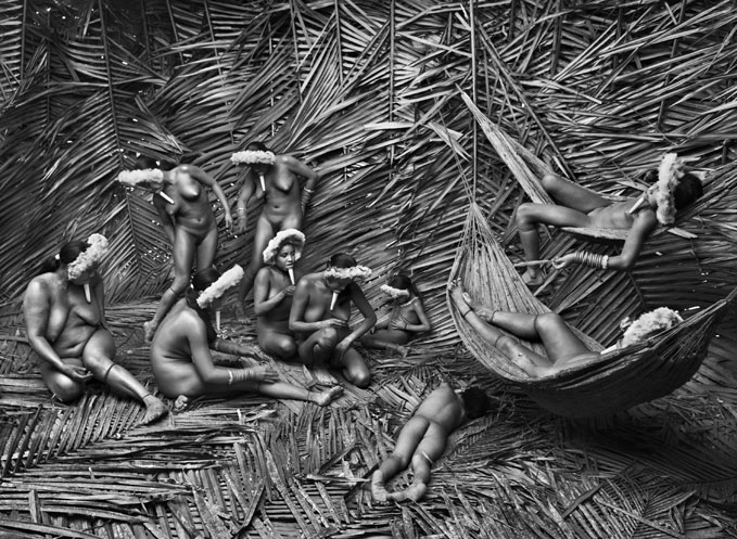 Sebasião Salgado, Typically, the women in the Zo'é village of Towari Ypy use the 'urucum' (Bixa orellana) red fruit to color their bodies. Pará State. Brazil. 2009.