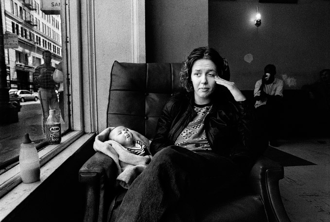 Darcy Padilla, USA, Agence Vu, First Prize Long-Term Projects. Family Love 1993-2014 - The Julie Project, 28 January 1993, San Francisco, California, USA, ‘I first met Julie on January 28, 1993. Julie, 18, stood in the lobby of the Ambassador Hotel, barefoot, pants unzipped, and an 8 day-old infant in her arms. She lived in San Francisco’s SRO district, a neighborhood of soup kitchens and cheap rooms. Her room was piled with clothes, overfull ashtrays and trash. She lived with Jack, father of her first baby Rachel, and who had given her AIDS. Her first memory of her mother is getting drunk with her at 6 and then being sexually abused by her stepfather. She ran away at 14 and became drug addict at 15. Living in alleys, crack dens, and bunked with more dirty old men than she cared to count. ‘Rachel,’ Julie said, ‘has given me a reason to live.’. For the next 21 years I photographed Julie Baird and her family’s complex story of poverty, AIDS, drugs, multiple homes, relationships, births, deaths, loss and reunion.