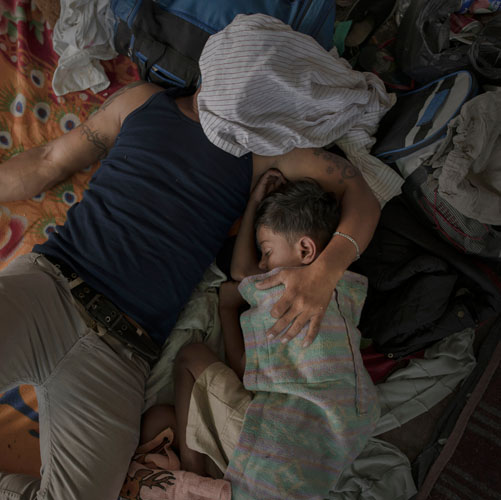 Pieter ten Hoopen, A father and son sleep after a long day's walking, Juchitán, 30 October 2018.
