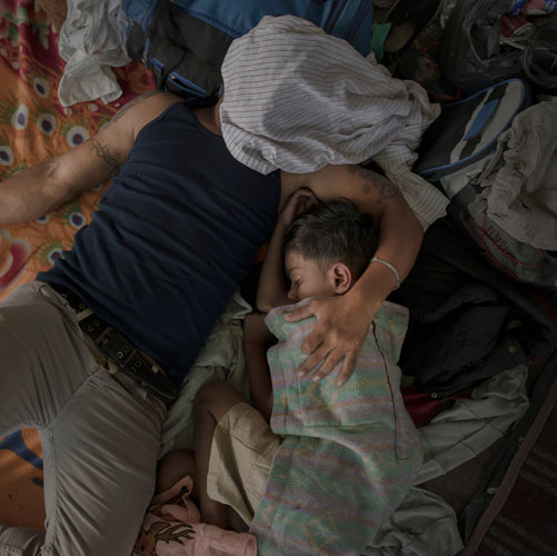 Pieter ten Hoopen, A father and son sleep after a long day's walking, Juchitán, 30 October 2018.