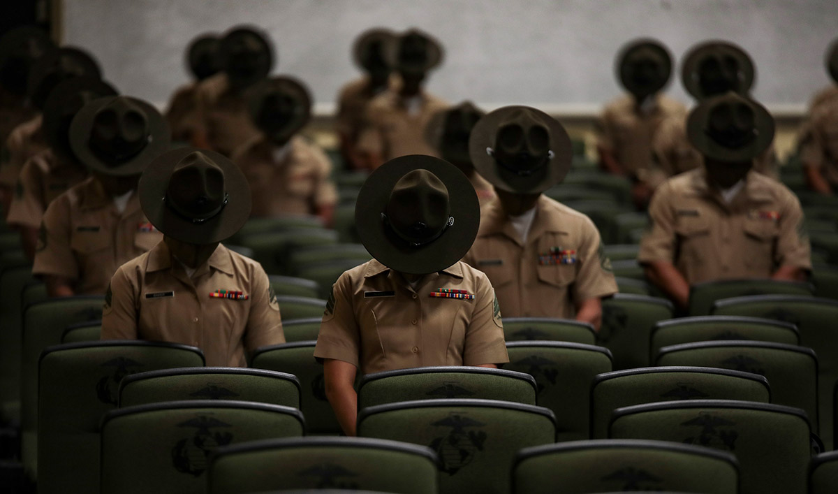 Dana Beesley, MVA Photographer of the Year, Graduates from Drill Instructor class 3-20 pause for a moment of prayer before their graduation ceremony on Marine Corps Recruit Depot Parris Island, S.C. June 18, 2020. The mission of Drill Instructor School is to further develop the leadership, command presence, instructional ability, knowledge, and physical condition of the selected noncommissioned officers, staff noncommissioned officers to successfully perform the duties of a drill instructor.