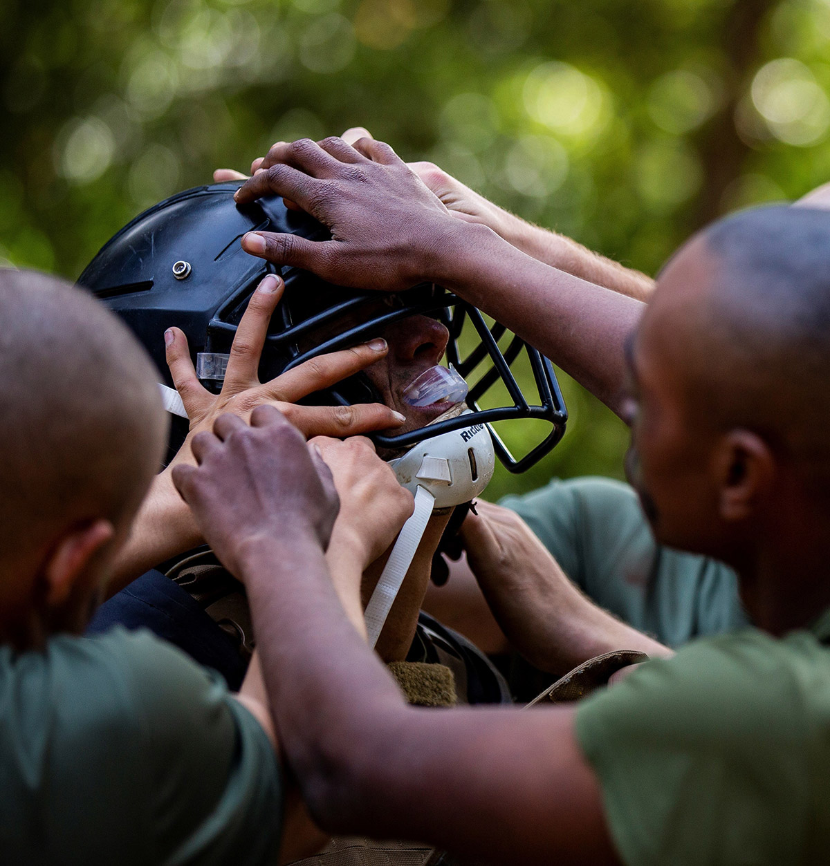 Dana Beesley, MVA Photographer of the Year, Recruits with Golf Company, 2nd Recruit Training Battalion, rush to assist a recruit in donning his gear during their Crucible boxing bouts on Marine Corps Recruit Depot Parris Island, S.C. Dec 3, 2020. The Crucible is recruit training's 54-hour culminating event that involves food and sleep deprivation and the completion of myriad events for recruits to complete in order to claim the title United States Marine.