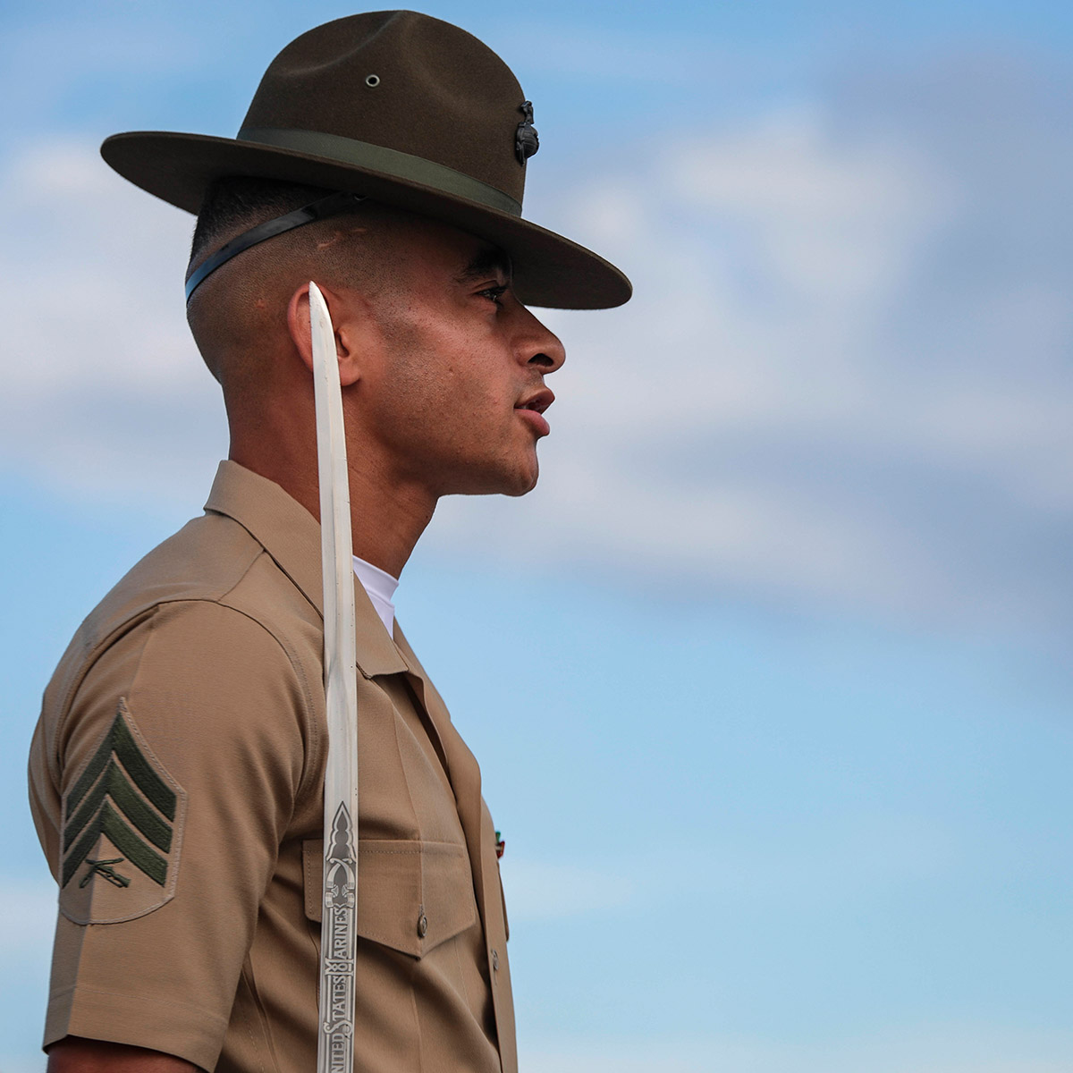 Dana Beesley, MVA Photographer of the Year, A drill instructor with Echo Company, 2nd Recruit Training Battalion, executes a drill card during evaluations at the Peatross Parade Deck on Marine Corps Recruit Depot Parris Island, S.C. June 10, 2020. The drill instructors are individually evaluated without a recruit platoon on their overall appearance, knowledge and bearing prior to initial and final drill.