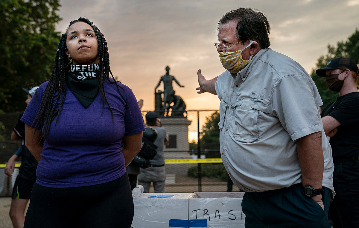 World Press Photo of the Year Nominee, Evelyn Hockstein, United States, Lincoln Emancipation Memorial Debate. Anais (26) argues for the removal of the Emancipation Memorial with a man (right) who wishes to keep it, in Lincoln Park, Washington DC, USA, on 25 June.